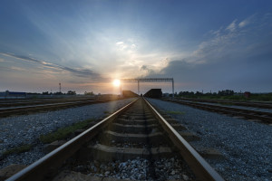 Cargo train platform at sunset with container